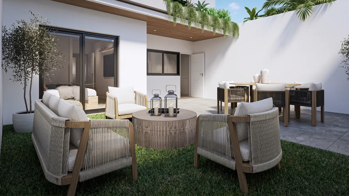 Espacio abierto de salón y cocina en una vivienda de Alborán One en Málaga